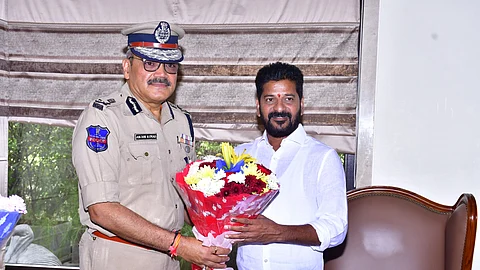 Telangana DGP Anjani Kumar with Revanth Reddy