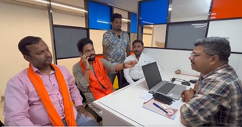 Hindu activists led by Anil Shetty speaking to the manager of Bengaluru's Garuda mall.