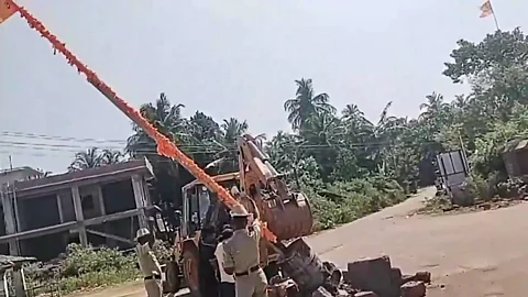 Flag post being taken down