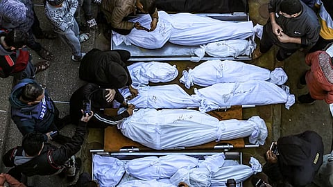 Palestinians mourn their relatives killed in an Israeli airstrike.