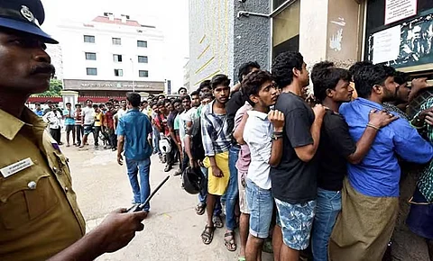 People crowding outside theatres