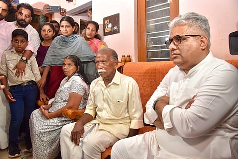 Union Minister Bhupender Yadav with the family of Ajeesh