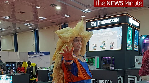 A cosplayer dressed as Super Saiyan Goku from Dragon Ball Z