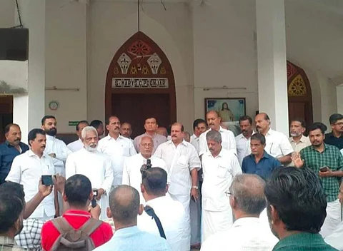 Protesters at the Poonjar church