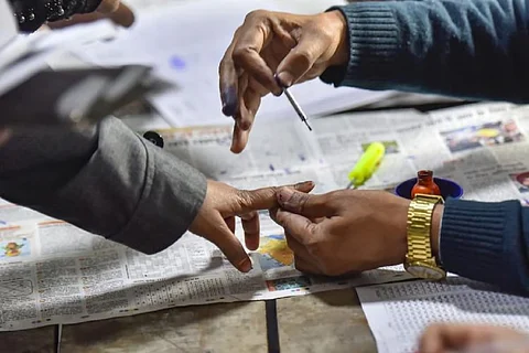 Representative image of a person voting.