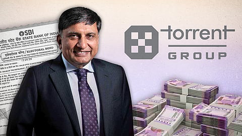 Sudhir Mehta with the Torrent Group logo