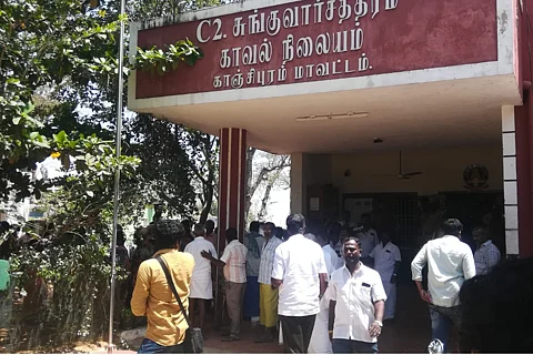 Residents including the 10 accused farmers outside the Sunguvarchatram police station after FIR was registered.