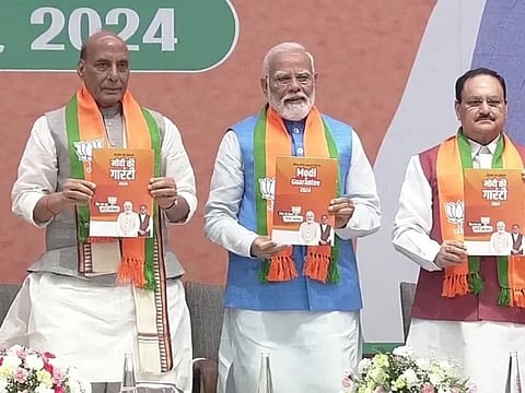 Narendra Modi releasing the manifesto