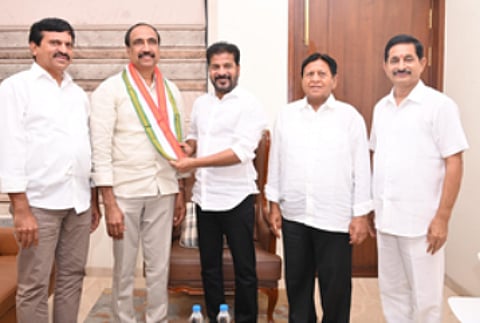 Sanjay Kumar with Revanth Reddy