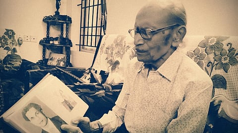 Harris Daniel with a photo of JC Daniel