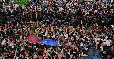 People gather on the streets with Bangladesh national flags