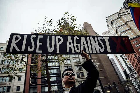 A protester in San Francisco during a visit by President Xi to California in 2023. AP/Alamy
