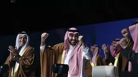 Saudi sports minister Abdulaziz bin Turki al-Faisal al-Saud celebrates the news.