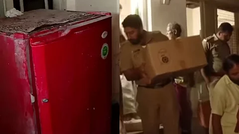 A red refrigerator and a group of people, including a uniformed person carrying a box, are shown in a hallway.