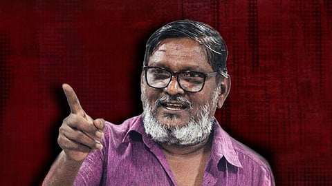 Writer Konangi wearing a pink shirt, against the backdrop of maroon background