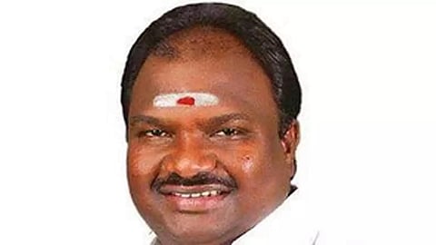 A close up of Erode East byepoll DMK candidate VC Chandhirakumar against a white background.