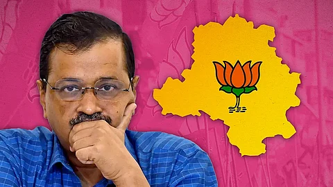 Arvind Kejriwal with a map of Delhi with a lotus symbol.
