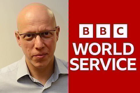 (L) BBC Correspondant Jonny Dymond in a pale grey shirt and wearing glasses in front of an off-white wall (R) Red and white logo of BBC World Services