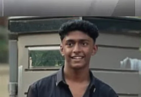 Image of Mohammed Shahabas wearing black shirt smiling in front of a metallic structure.