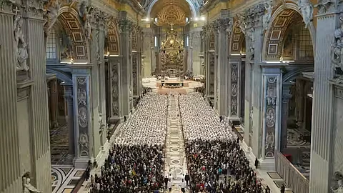 Deacons take part in a mass in St. Peter’s Basilica that was supposed to be presided over by Pope Francis.