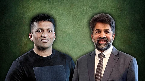 Two men are seen in the picture against a dark background.
