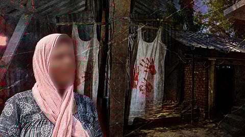 A woman adorned in a pink scarf poses in front of a house, reflecting the memory of the Walayar sisters.