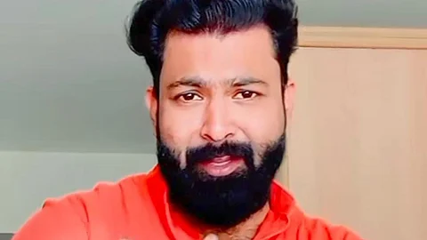 Screengrab image of Junaid wearing red shirt