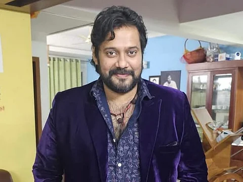 image of actor Bala wearing blue dress