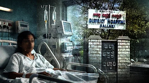 A woman sitting up in a hospital bed surrounded up monitors and IV drips. In the background is the Ballari District Hospital.