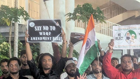 Protesters holding up placards against new Waqf law at AIMIM headquarters Darussalam in Hyderabad