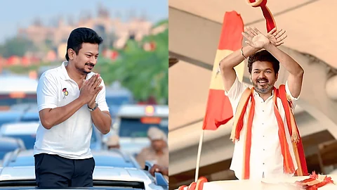 Split image showing two Indian political figures. On the left, Udhayanidhi Stalin, wearing a white polo shirt with a party logo, stands through a car sunroof, greeting with folded hands. On the right, actor Vijay, dressed in a white shirt with a red and yellow scarf, stands on a stage, smiling and making a hand gesture with arms crossed above his head, with red and yellow flags in the background.