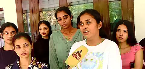 Image featuring a group of Malayali students who reached Delhi, speaking to the media.