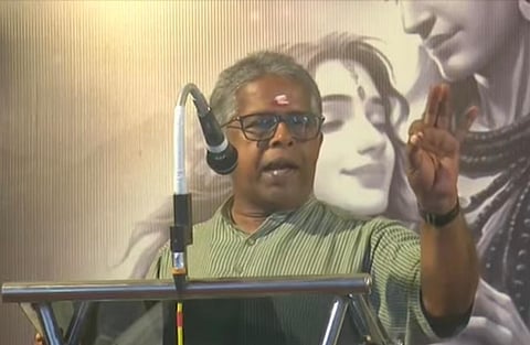 Image featuring RN Madhu speaking, wearing a green shirt.