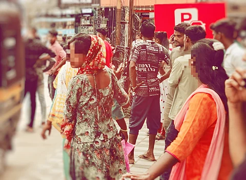 women in salwar standing in a street