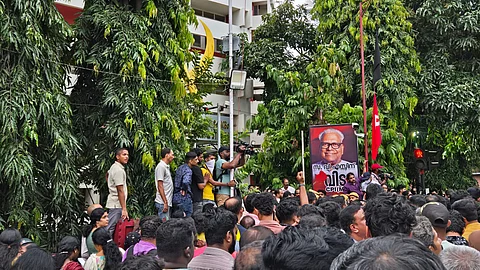People gathers outside the AKG Centre in Thiruvananthapuram