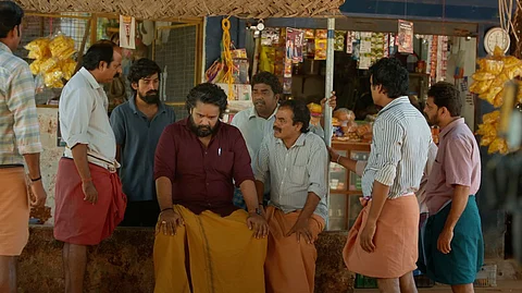 Image from the film showing men gathered in front of a local grocery store.