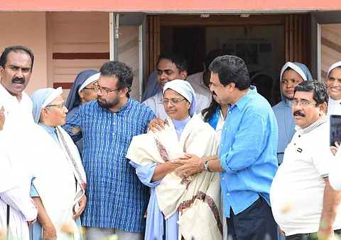 John Britas with nuns
