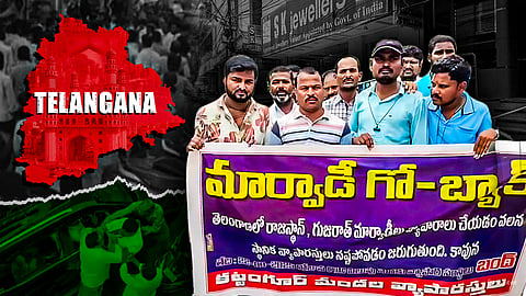 A protest scene in Telangana showing a group of men holding a banner in Telugu with the words “Marwadi Go Back” highlighted. Behind them are closed jewelry shops, including one named “S.K. Jewellers.” On the left, a red map of Telangana with “TELANGANA” written across it overlays an image of Charminar. The overall theme suggests tension between local traders and Marwadi communities.