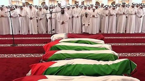 Qatar’s Emir Sheikh Tamim bin Hamad Al-Thani at the funeral of people killed in the Israeli strike.