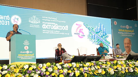 Finance Minister KN Balagopal speaks at the concluding session of the state-level seminar on Finance Department's achievements and future perspectives. Industries Minister P Rajeev is among those seated on stage.