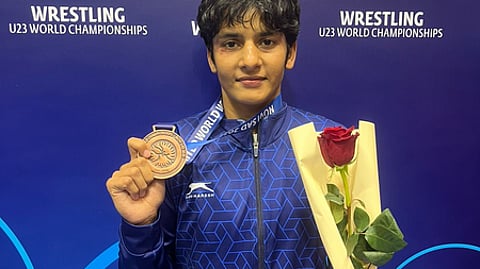 Wrestler holding medal