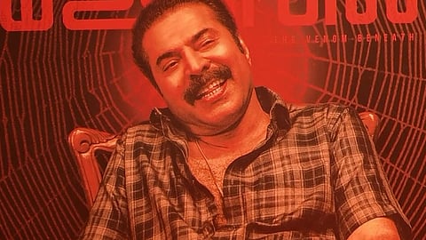 Picture of Mammootty facing the sreen, clad in shirt and mundu