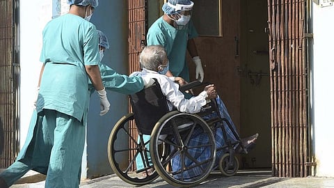 A patient in a wheelchair at a hospital