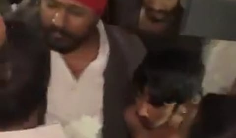 An angry mob surrounding and hounding the accused at the Katta Maisamma temple.