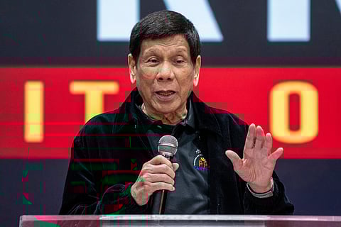 Former President of the Philippines Rodrigo Duterte speaks inside the Southorn Stadium during a thanksgiving gathering organized by Hong Kong-based Filipino workers for the former populist president in Hong Kong on March 9, 2025.