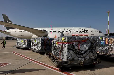 Workers load medical aid onto an Air India plane to be flown to India, at Ben Gurion Airport near Tel Aviv, Israel, May 4, 2021.
