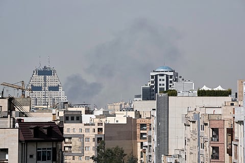 Smoke rises on the skyline after an explosion in Tehran, Iran, Saturday, Feb. 28, 2026.