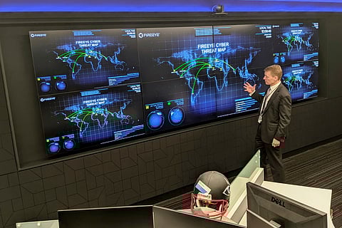 The CEO of FireEye Kevin Mandia gives a tour of the cybersecurity company's unused office space in Reston, Va., March 9, 2021.