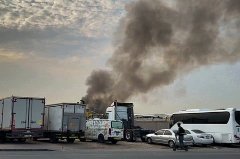 Smoke billowing after projectile interception at Dubai's Al Quoz industrial are