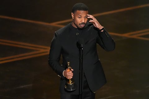 Michael B. Jordan accepts the award for actor in a leading role for "Sinners" during the Oscars on Sunday, March 15, 2026, at the Dolby Theatre in Los Angeles. (AP Photo/Chris Pizzello)